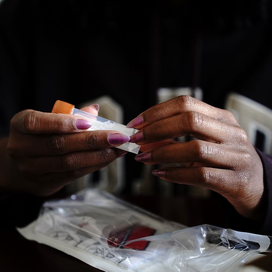 A person opening the stool collection tube from an Epicentre gut health kit